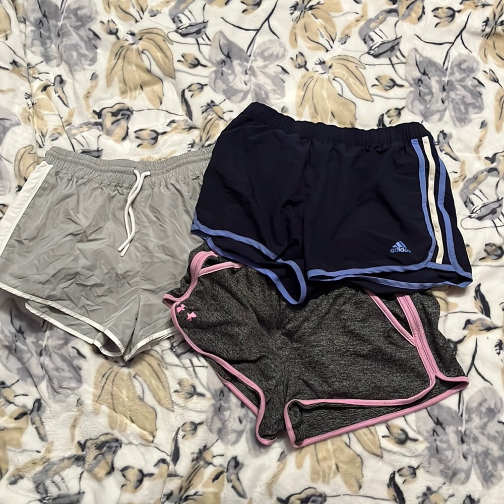 three pairs of athletic shorts.